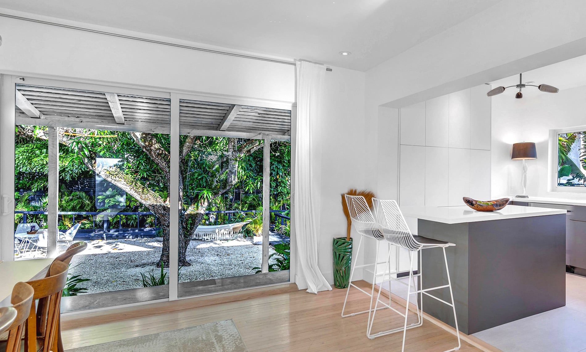 Coconut Grove home renovation - kitchen area with a sliding door to the backyard designed by Beatrice Leupold Coconut Grove home renovation - kitchen area with a sliding door to the backyard designed by Beatrice Leupold